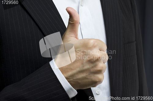 Image of Business man with thumbs up