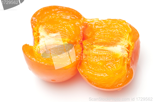 Image of An opened orange persimmons isolated on white background 