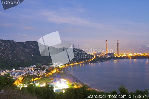 Image of Power station along the seashore at night 