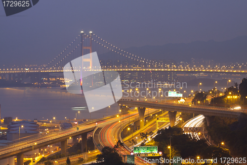 Image of Tsing Ma Bridge and highway at sunset, show the modern landscape