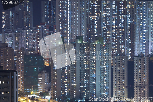 Image of Hong Kong crowded apartments at night - The feeling of "Under th