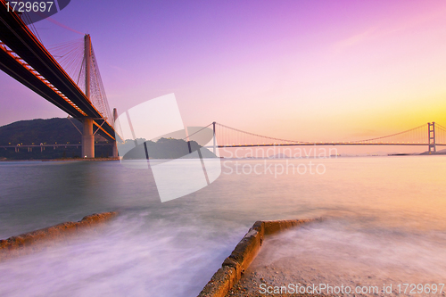 Image of Hong Kong bridges at sunset over the ocean