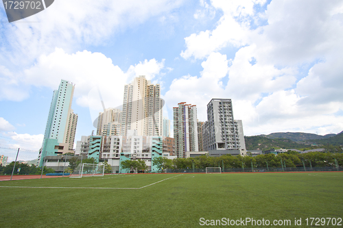 Image of Hong Kong downtown with residential buildings and sports court
