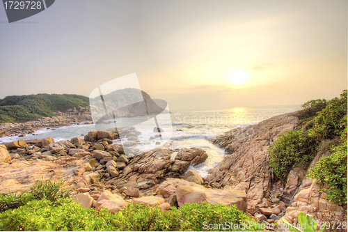 Image of Sea stones along the coast at sunrise