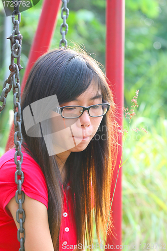 Image of Asian woman in a sad mood