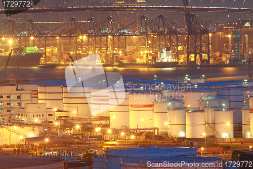 Image of Oil tanks at night in container terminal 