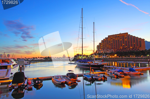 Image of Yacht pier at sunset time under long exposure in Hong Kong, Gold