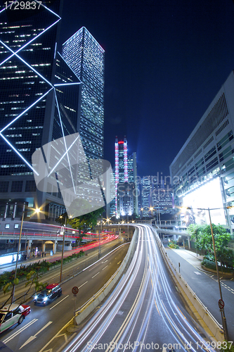 Image of City night traffic with light trails
