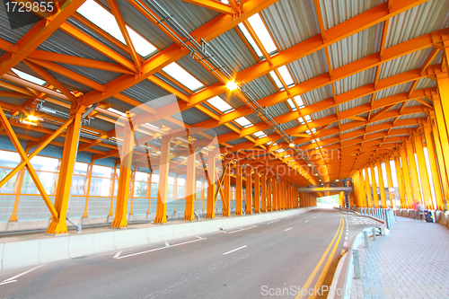 Image of Orange tunnel and highway at day