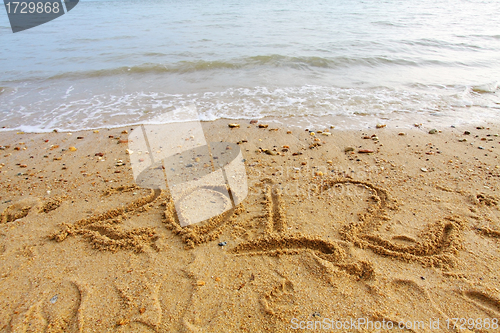 Image of 2012 handwritting on sand