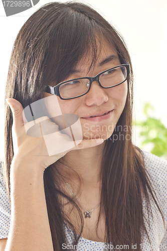 Image of Asian woman talking on phone