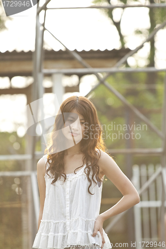 Image of Asian woman thinking oneself