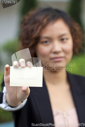 Image of Business woman holding a name card