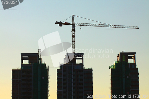 Image of Construction site with crane and building 