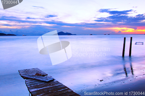 Image of Sunset along a wooden pier