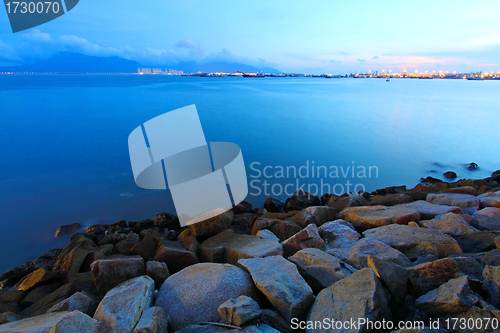 Image of Sunset along the coast in Hong Kong with rocks