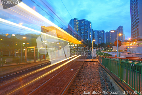 Image of Traffic in Hong Kong at night. Light rail.