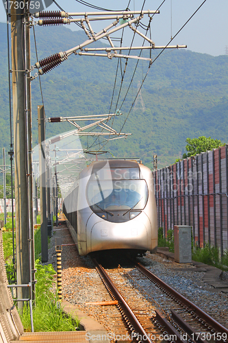 Image of Fast train with passengers in Hong Kong at day