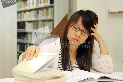 Image of Asian girl student in library