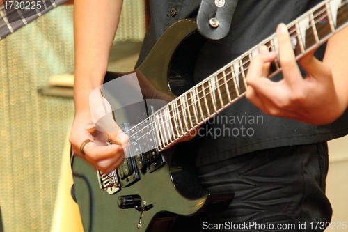 Image of Playing guitar