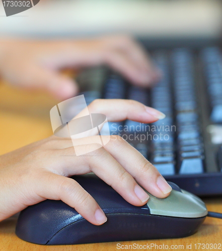 Image of Human hands using computer