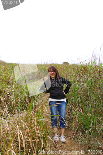 Image of Asian girl hiking with smile