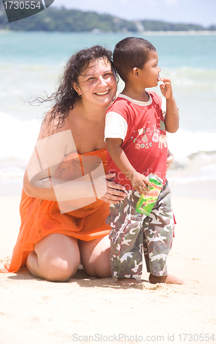 Image of Russian woman hugs a Thai child