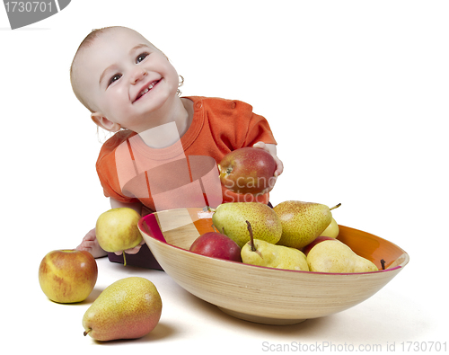 Image of baby with apples and pears