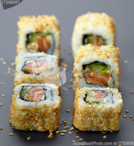 Image of sushi with salmon and cucumber