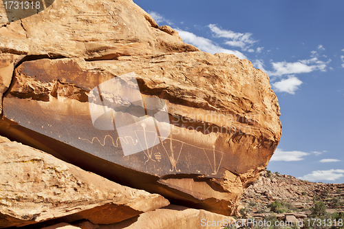 Image of ancient rock art with snake 