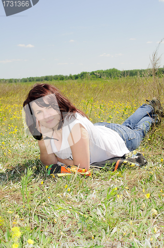 Image of Woman resting on the grass
