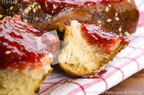 Image of Sweet bread ( challah ) with strawberry jam