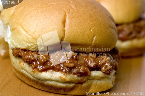 Image of sloppy joe sandwich with tomatoes onions