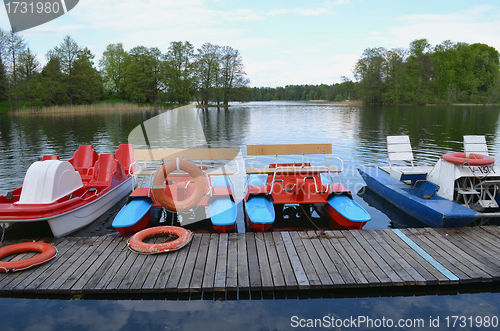 Image of water bicycles lock lake harbor and rescue circles 