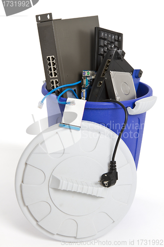 Image of electronic scrap in trash can