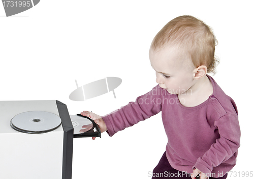 Image of young child playing with CD