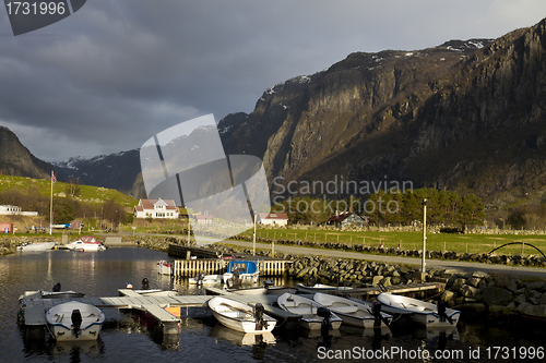 Image of small harbor with mountains in background