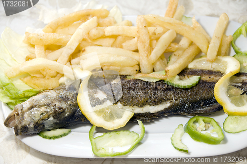 Image of whole grilled fish plate Tunisia food