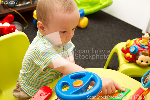 Image of Baby Playing With The Toys