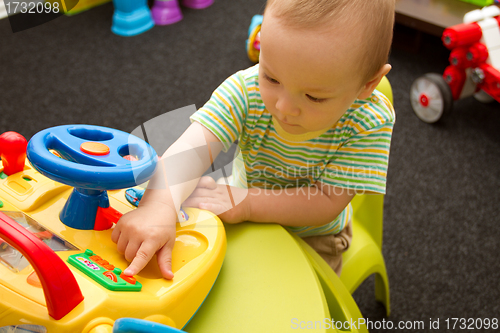 Image of Baby Playing With The Toys