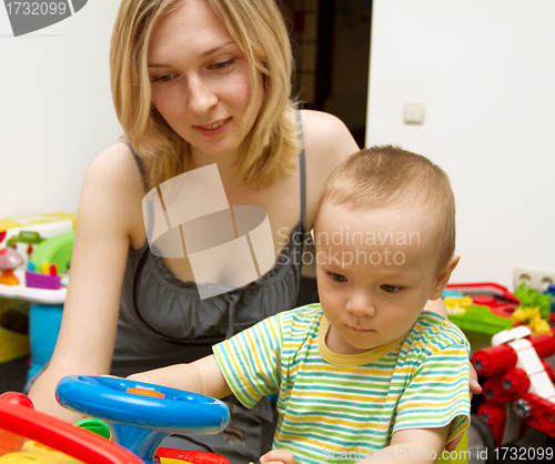 Image of Baby And Mother Playing With The Toys