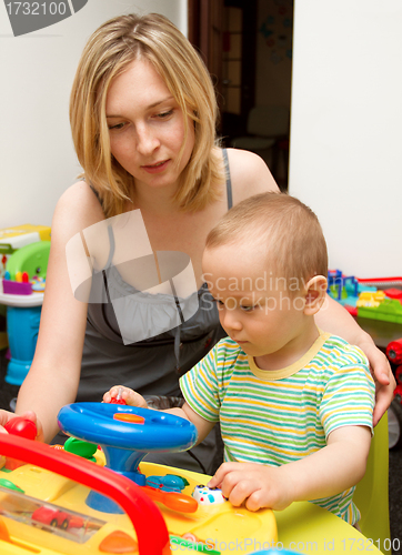 Image of Baby And Mother Playing With The Toys