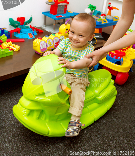 Image of Baby And Mother Playing With The Toys