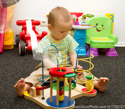 Image of Baby Playing With The Toys