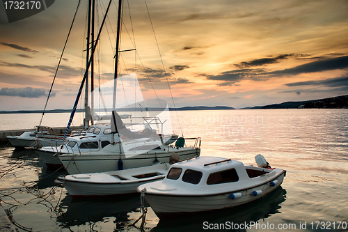 Image of Fishing boats in Adriatic sea with sunset light