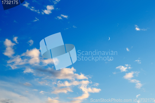 Image of beautiful sunset clouds with the moon