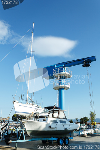 Image of crane in yachts service and shipyard in port