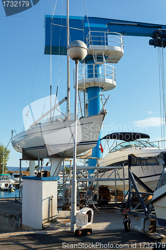 Image of crane in yachts service and shipyard in port