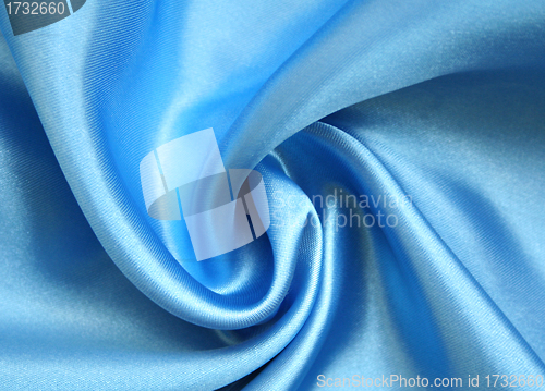 Image of Smooth elegant blue silk as background 