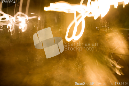 Image of Chaotic forms with the fire of cigarettes in a dark room